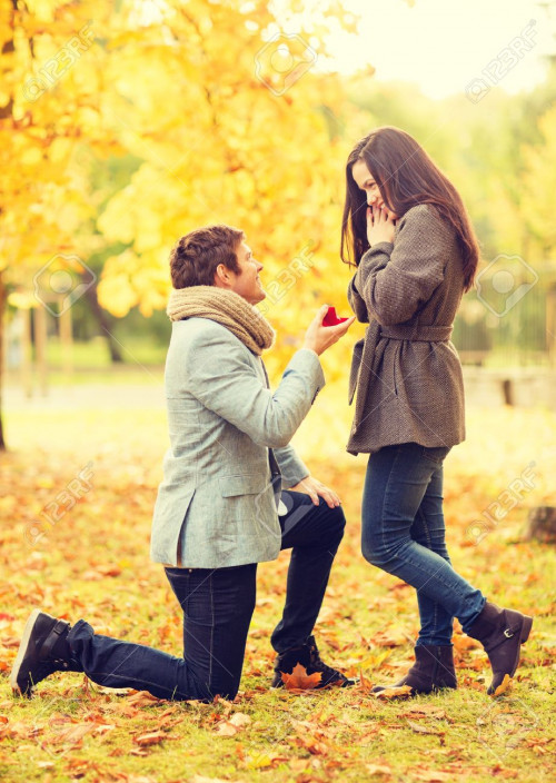 29244245-holidays-love-couple-relationship-and-dating-concept-kneeled-man-proposing-to-a-woman-in-the-autumn.jpg