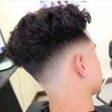 Low-Skin-Fade-with-Curly-Hair-on-Top