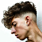 Low-Skin-Fade-with-Long-Curly-Fringe