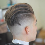 Mens-Undercut-Hairstyle-Long-Slick-Back-with-Bald-Fade