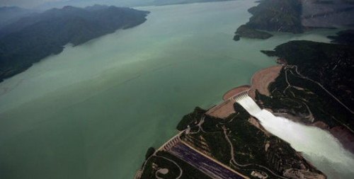 It is the largest dam in the world with respect to structural volume. It was completed in 1976 and it stores water from Indus river in Pakistan.