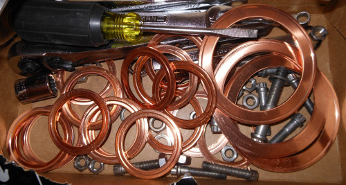 Used_copper_flange_gaskets_for_ultrahigh_vacuum_systems.jpg